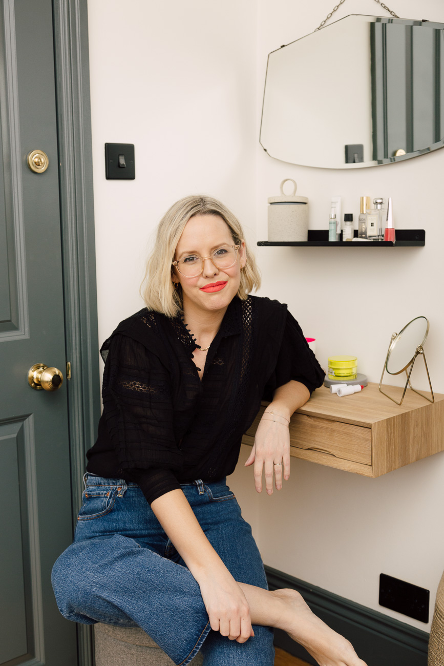 Alexandra Stedman of The Frugality sat at her dresser table wearing the 'Unattached' Stunna lip paint by Fenty Beauty.