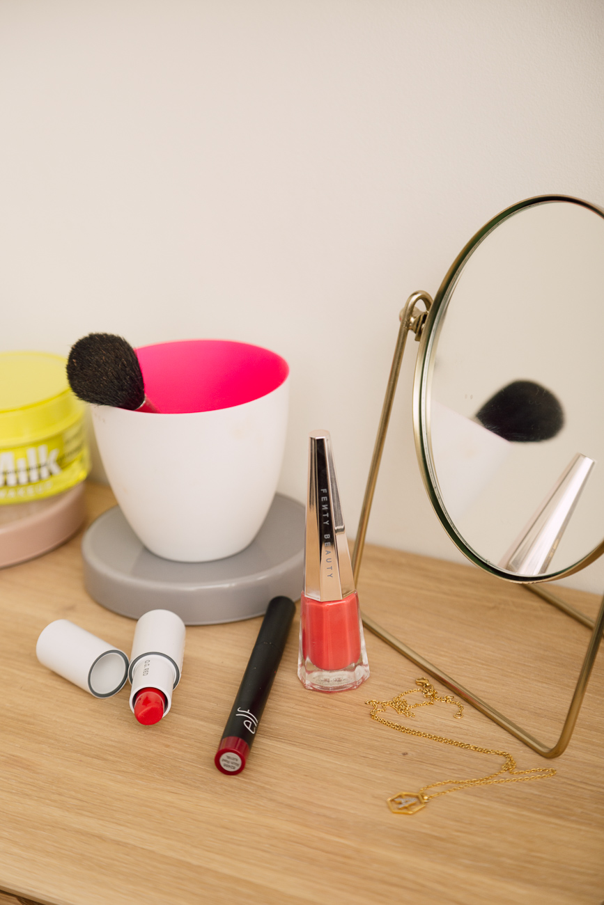 A close up of three cruelty free red lip sticks, they are: O.G. Red by Milk, 'Rich Red' by e.l.f. and 'Unattached' by Fenty.